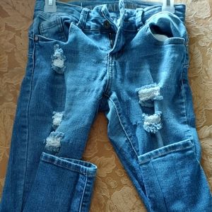 Junior size 3 jeans bought in distressed condition brand new.